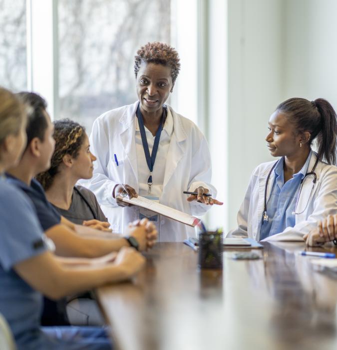Female Doctor and Mentor Teaching Nursing Students