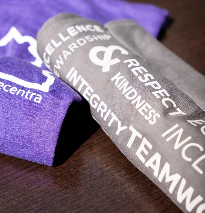 Centra branded t-shirts with the brand typography in focus