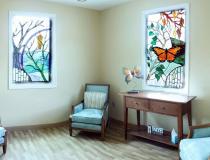 Chapel with stained glass windows and butterfly at Centra Bedford Hospice House